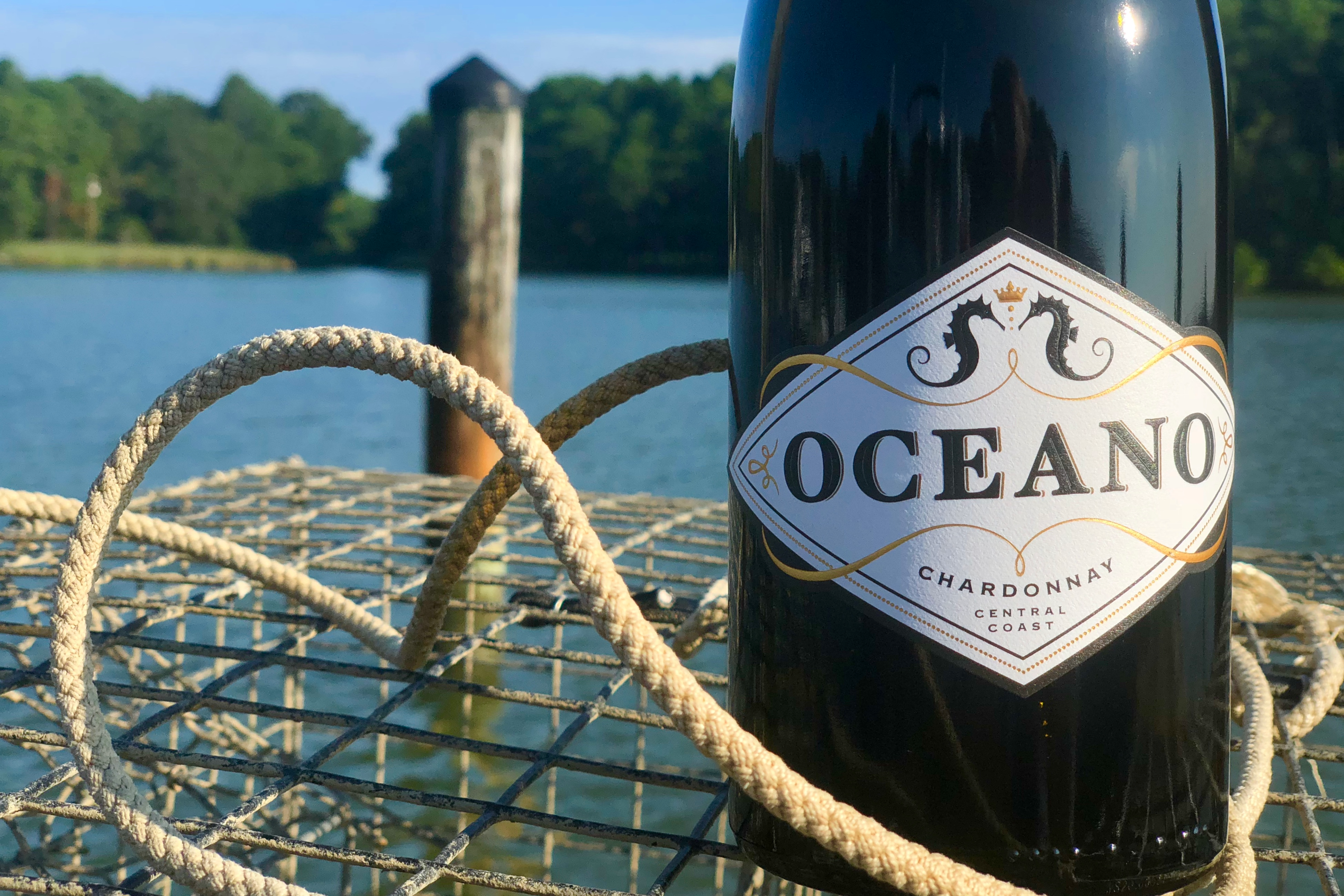 Oceano Chardonnay bottle on top of crab cage