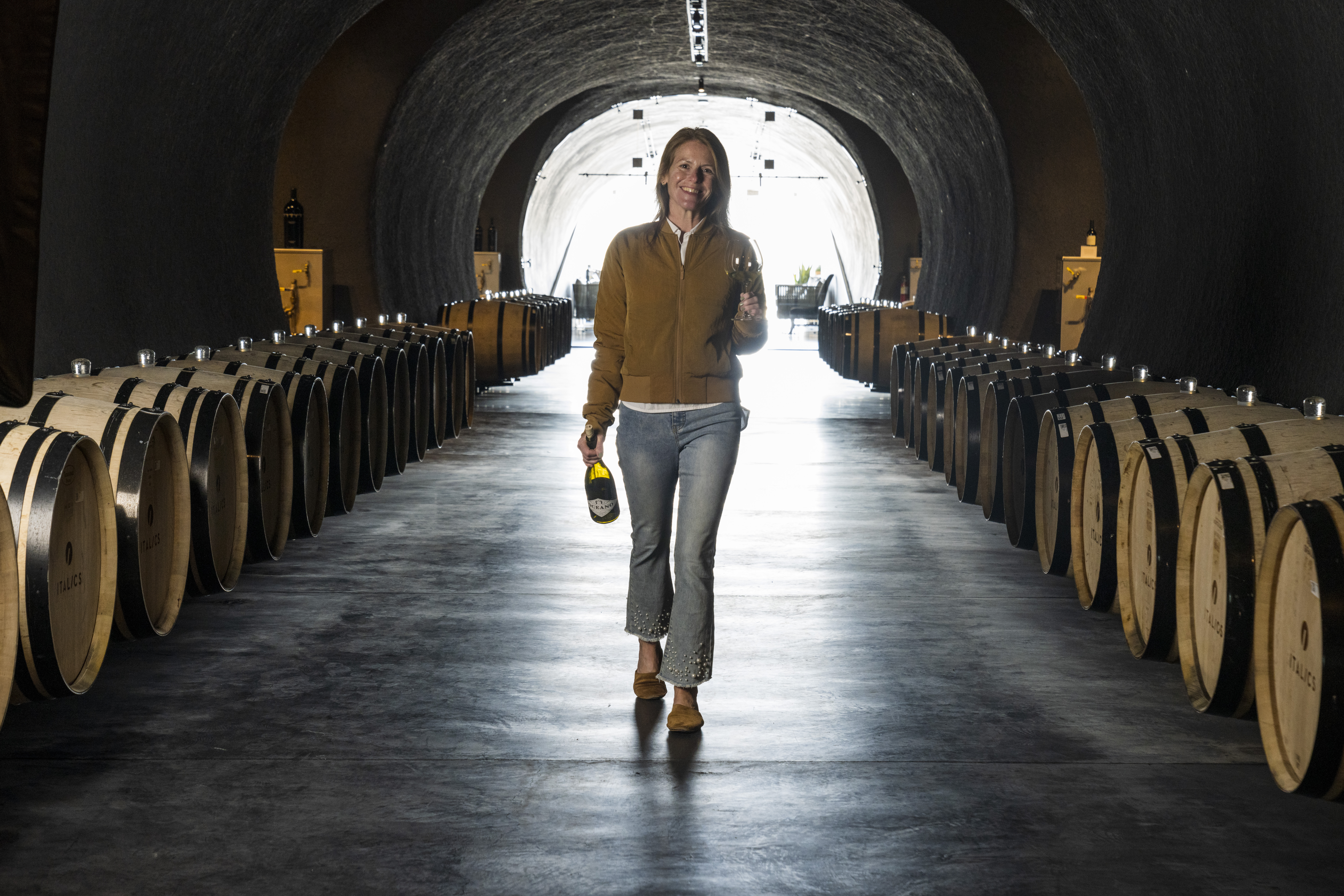 Rachel Martin walking down winery alley