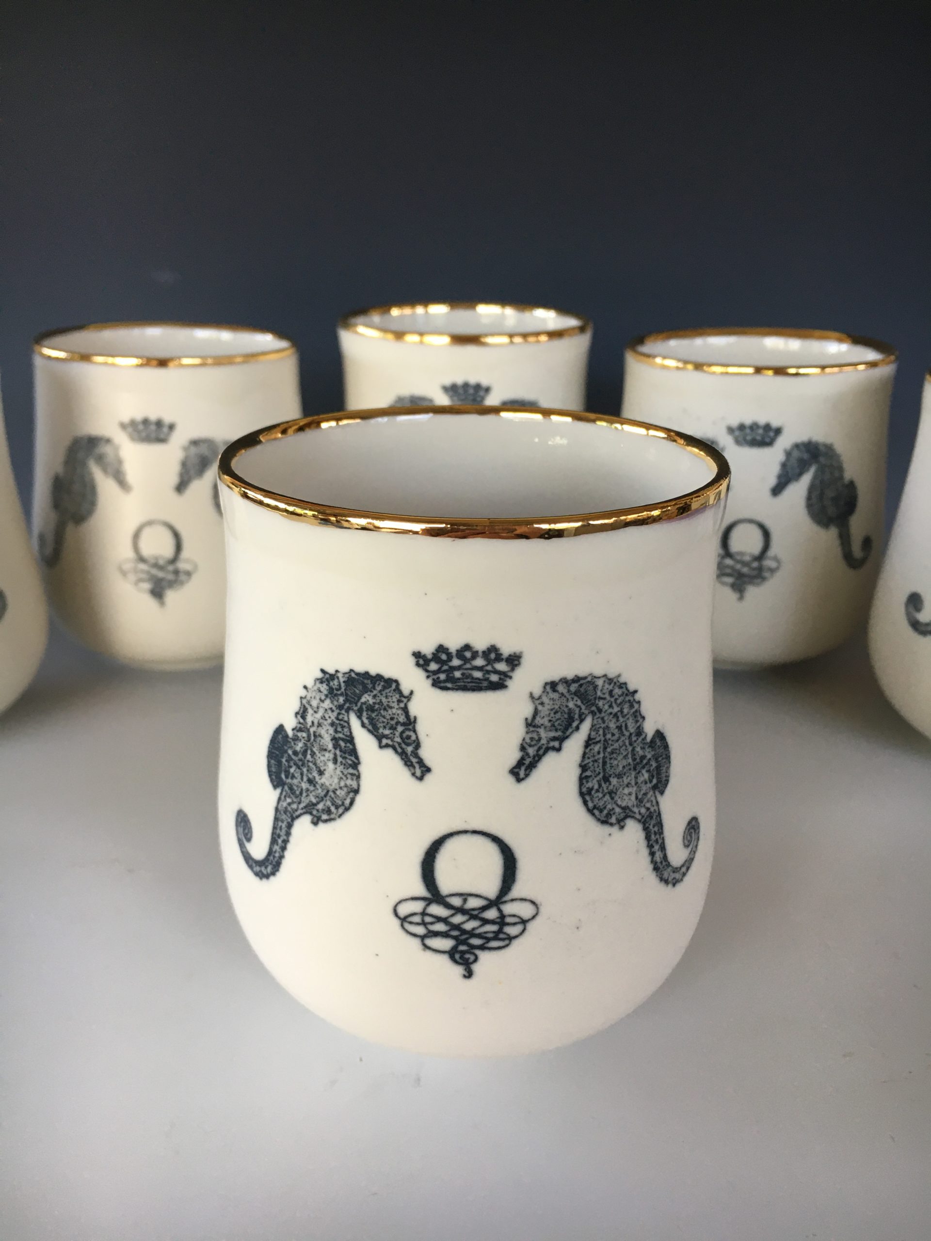 white wine glass goblets with seahorses and Oceano logo painted on