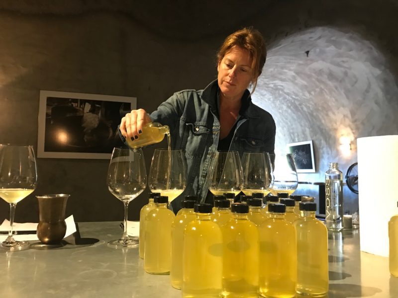 Rachel Martin pouring wine samples in glasses