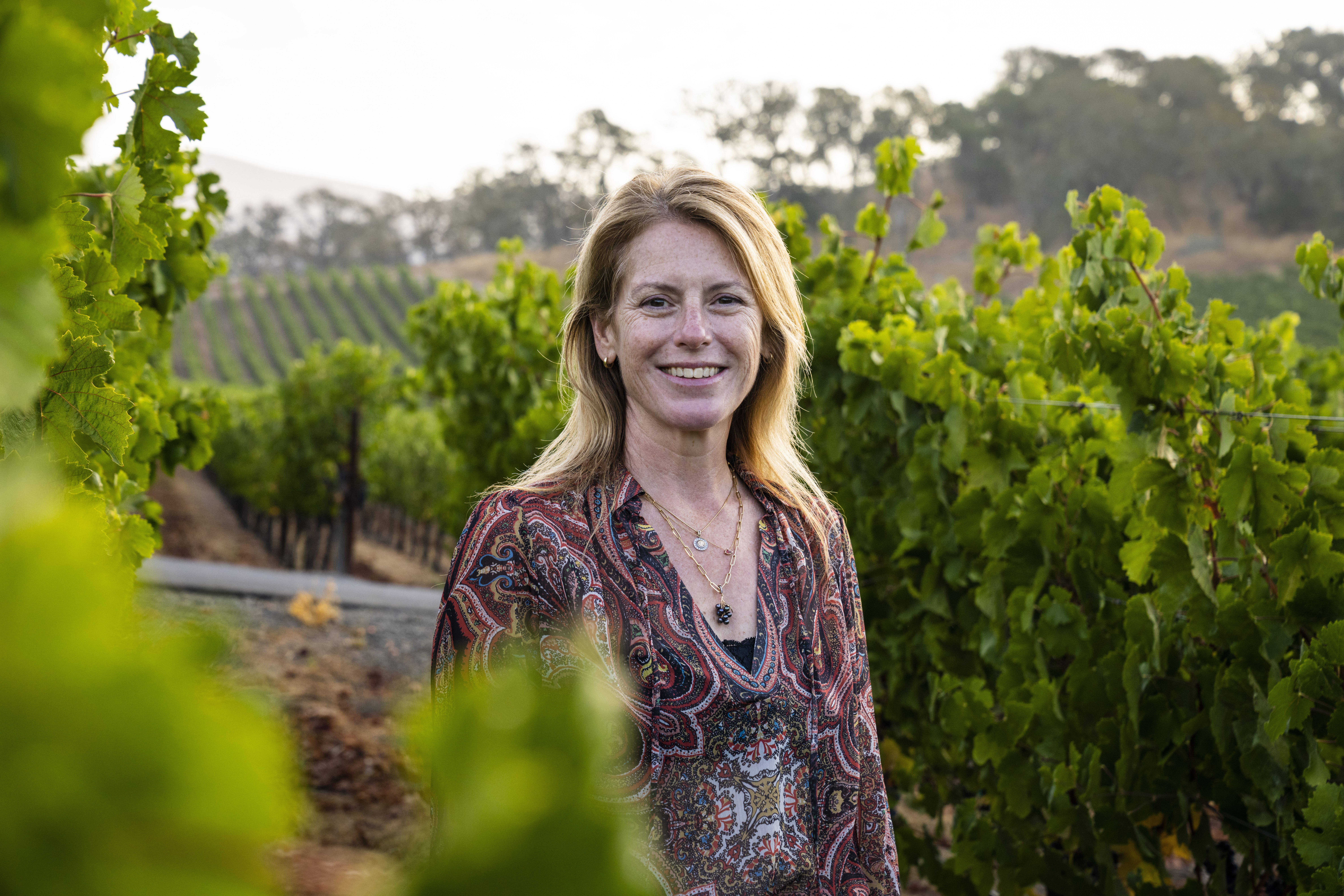 Rachel Martin standing in vineyard