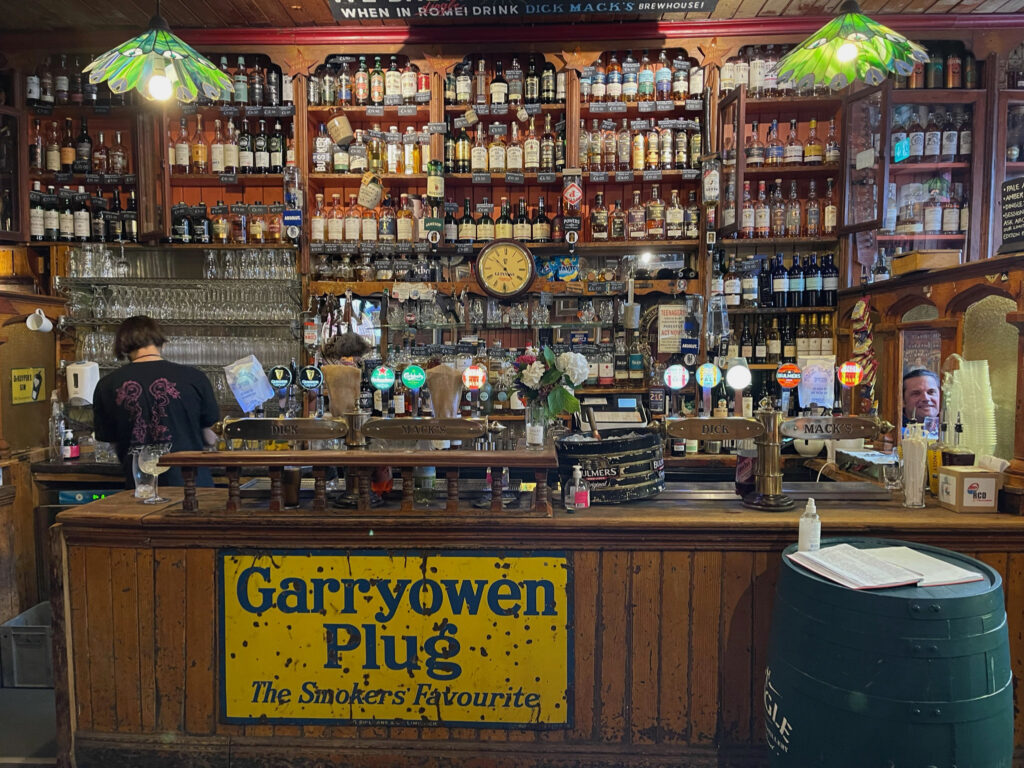 A bar with a sign that reads "Garryowen Plug The Smokers Favorite."