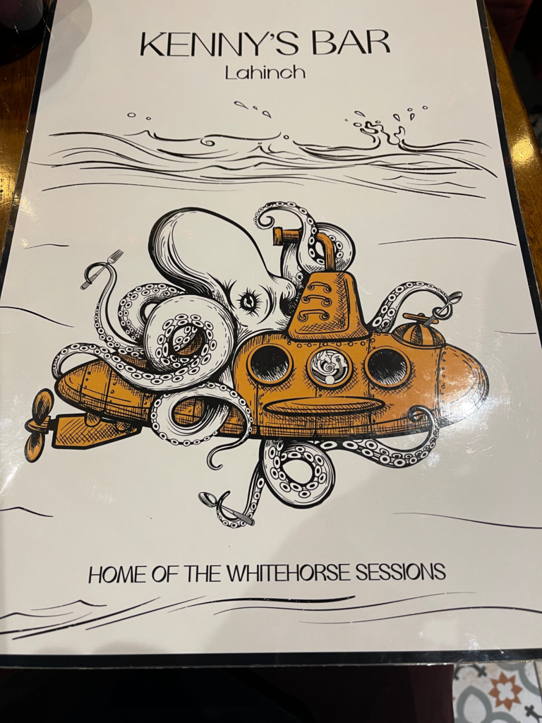 The front of the menu for Kenny's bar, which shows a yellow submarine being grabbed by an octopus.