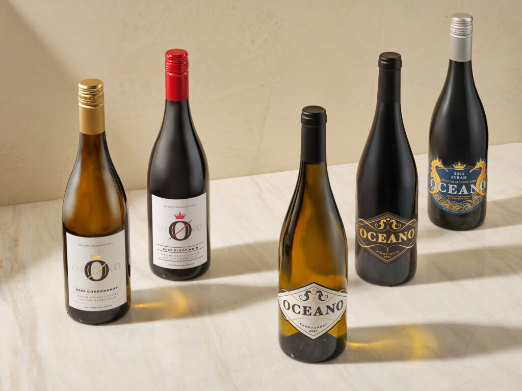 Five Oceano Signature Wine bottles sitting on a counter together.