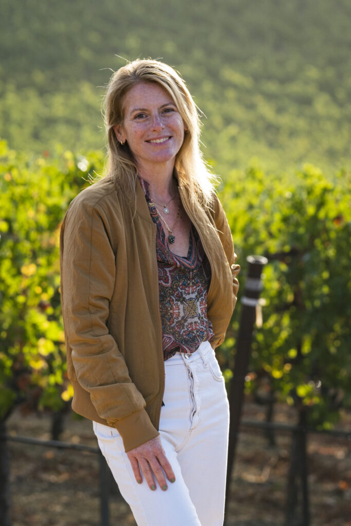 Rachel Martin posing in a california vineyard.