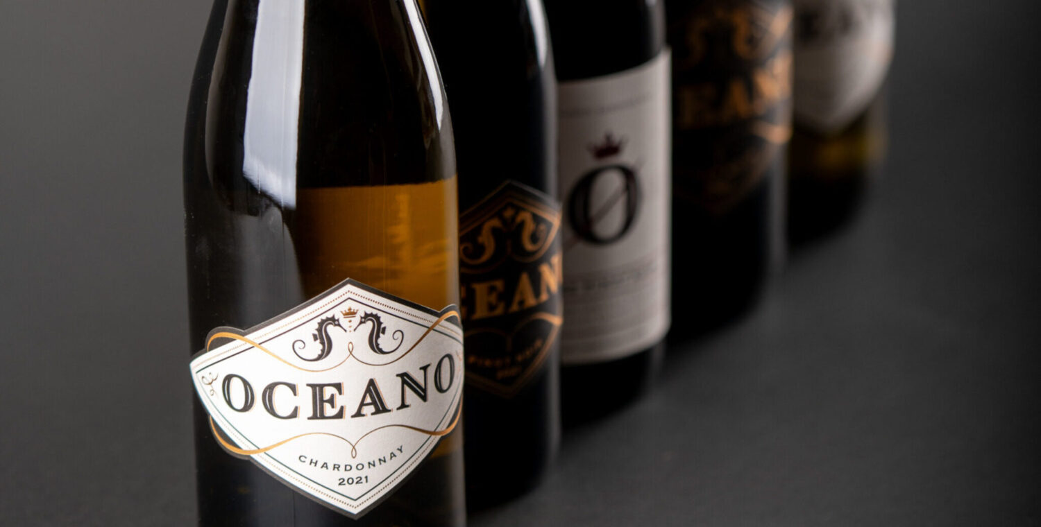 A line up of different oceano wine bottles.